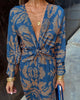 Robe midi imprimée avec nœud sur le devant et décolleté en V profond