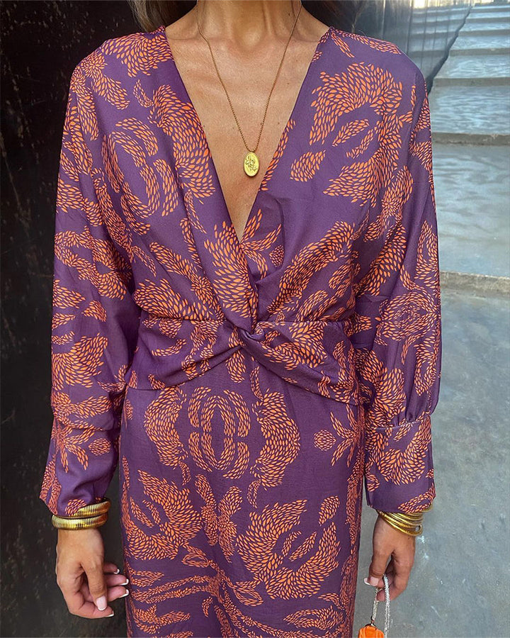 Robe midi imprimée avec nœud sur le devant et décolleté en V profond