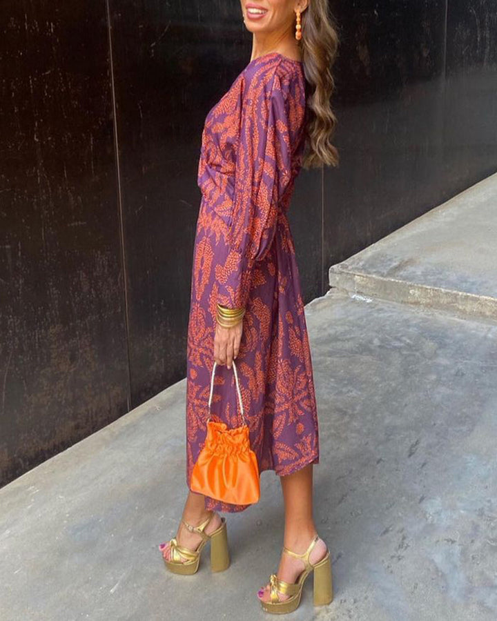 Robe midi imprimée avec nœud sur le devant et décolleté en V profond