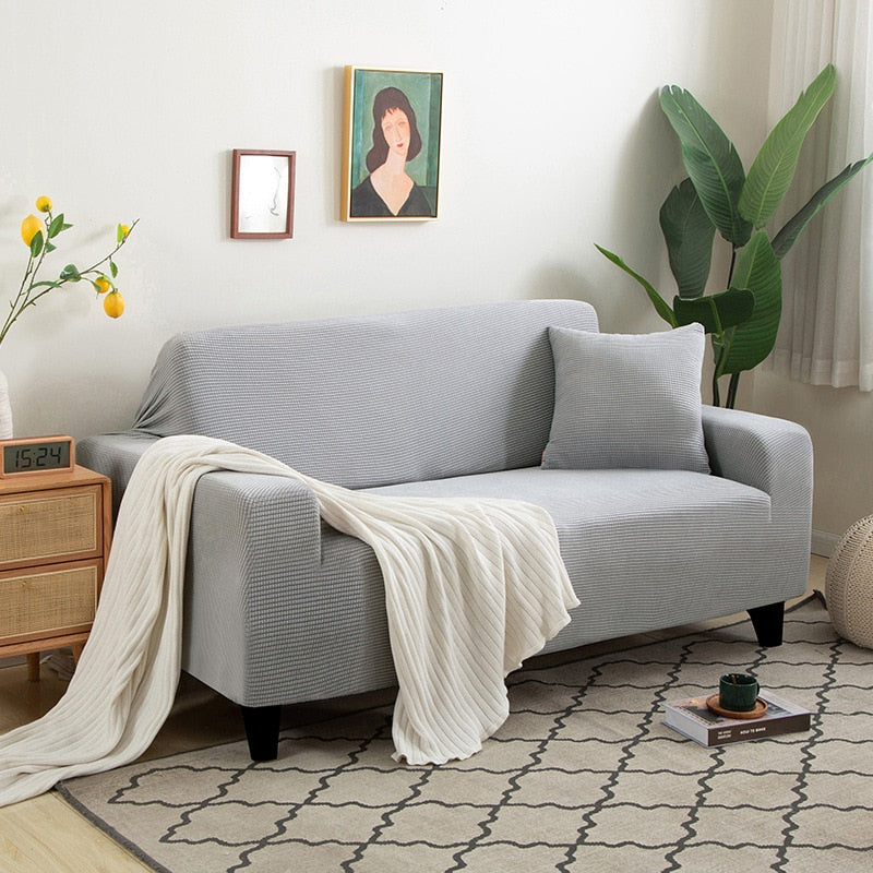 Housse de canapé extensible texturée et antidérapante